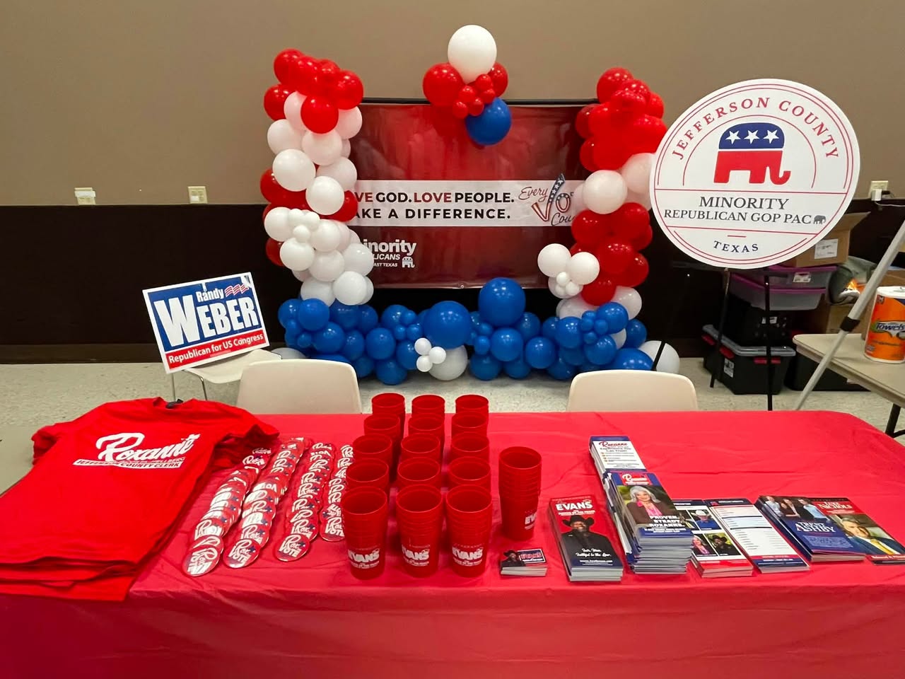 The PAC outreach table with campaign literature, balloons and the organization’s sign.